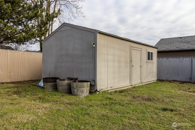 view of outbuilding featuring a yard