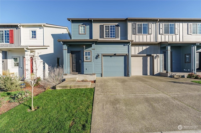 view of front of property with a garage and a front lawn