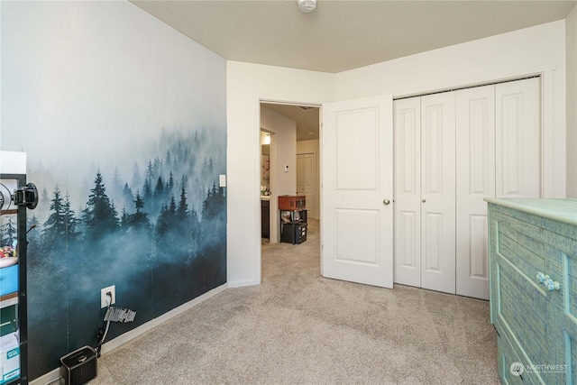 unfurnished bedroom with a closet and light carpet