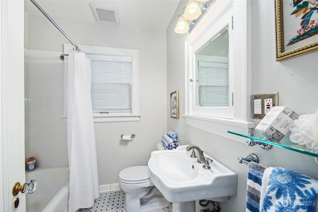 full bathroom featuring sink, toilet, and shower / tub combo with curtain