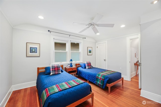 bedroom with ceiling fan and hardwood / wood-style flooring