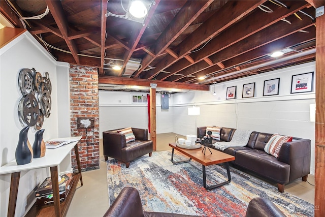 living room featuring electric panel and concrete floors