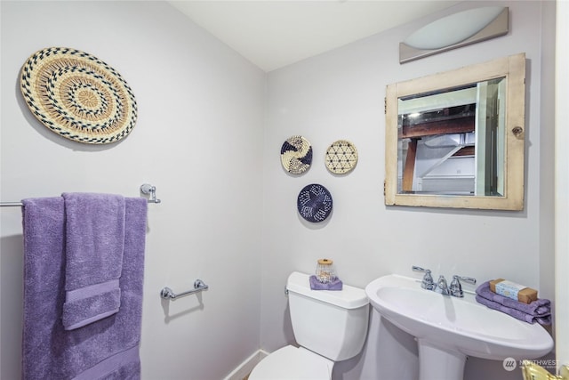 bathroom featuring sink and toilet