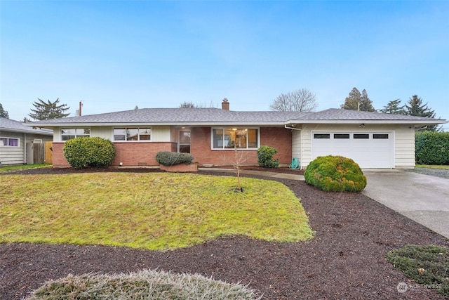 ranch-style home with a garage and a front lawn