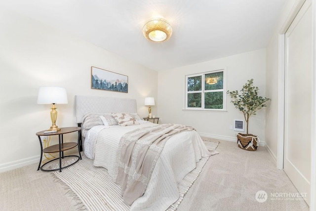 bedroom with light colored carpet