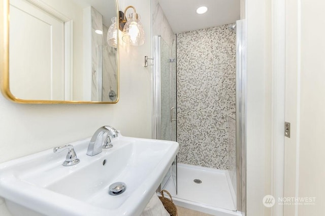 bathroom with sink and walk in shower