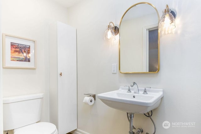 bathroom with sink and toilet