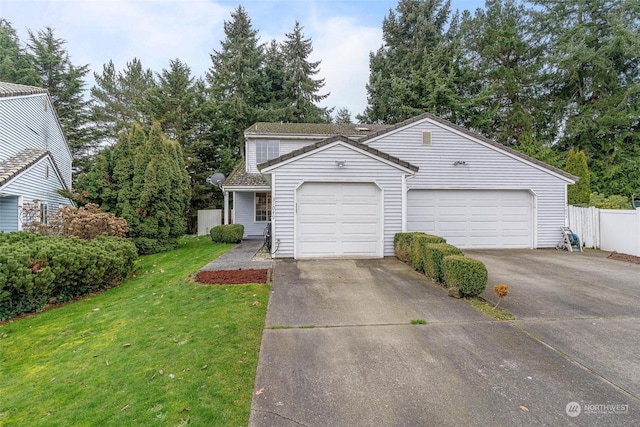 view of front of house featuring a front lawn and a garage