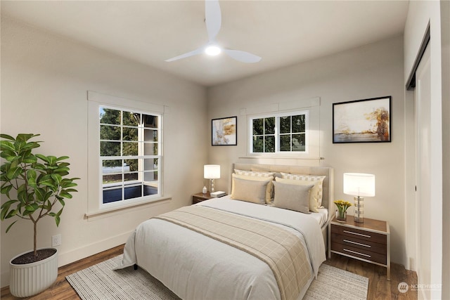 bedroom with dark wood-type flooring and ceiling fan