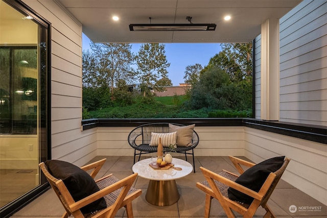 view of balcony at dusk