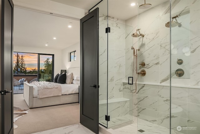 bathroom featuring a shower with shower door