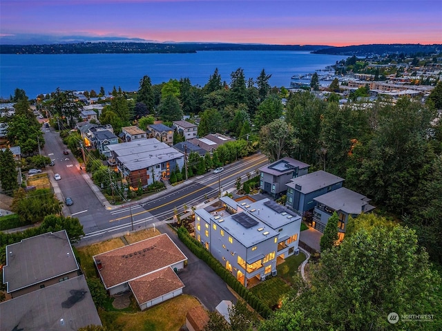 aerial view at dusk with a water view