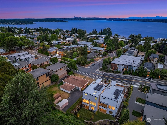 aerial view at dusk with a water view