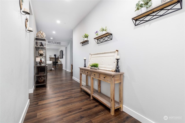 corridor with dark hardwood / wood-style floors