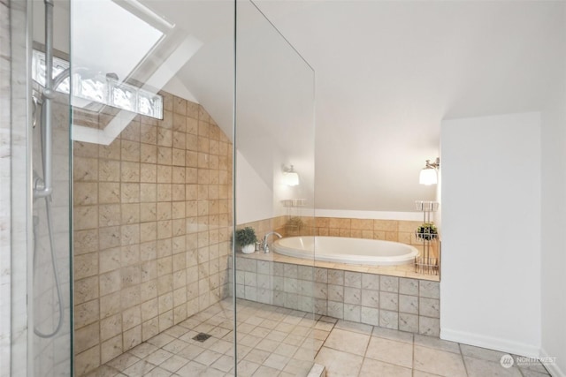 bathroom with lofted ceiling, tile patterned floors, and plus walk in shower