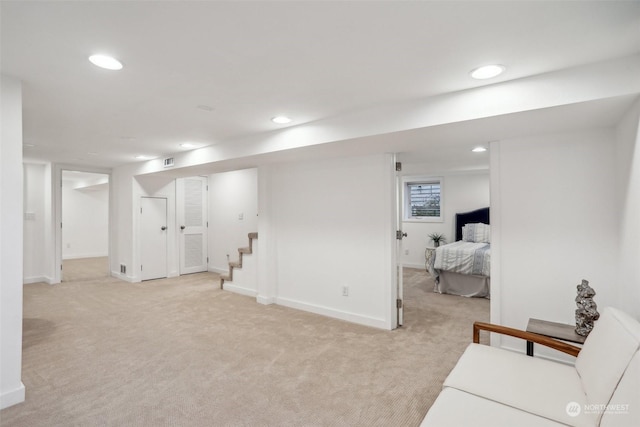 basement with light colored carpet