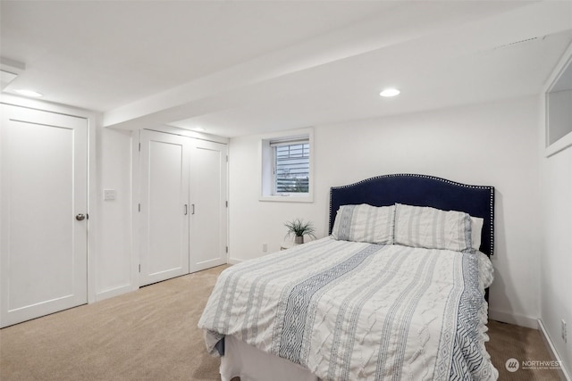 bedroom with light colored carpet