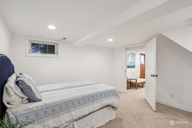 bedroom with light colored carpet