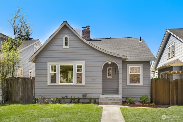 bungalow with a front yard