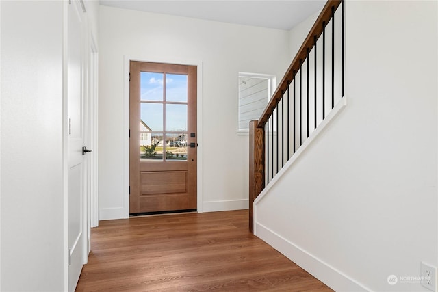 entryway with hardwood / wood-style floors