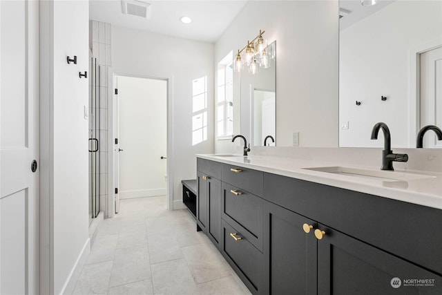 bathroom featuring tile patterned floors, walk in shower, and vanity