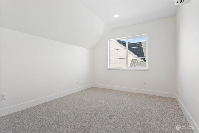 bonus room featuring lofted ceiling and carpet floors