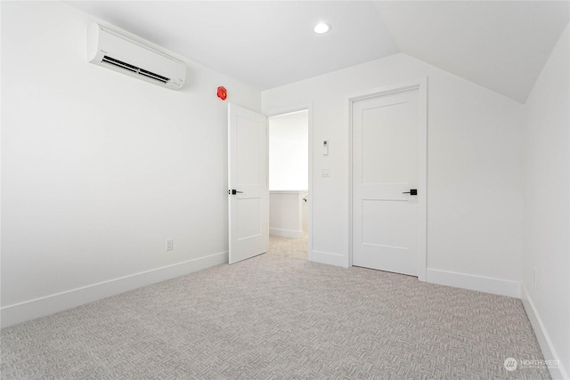 bonus room with lofted ceiling, light colored carpet, and a wall unit AC