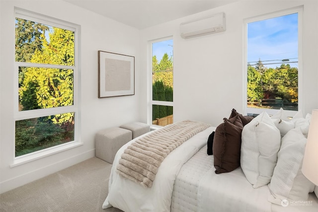 bedroom with carpet and a wall unit AC