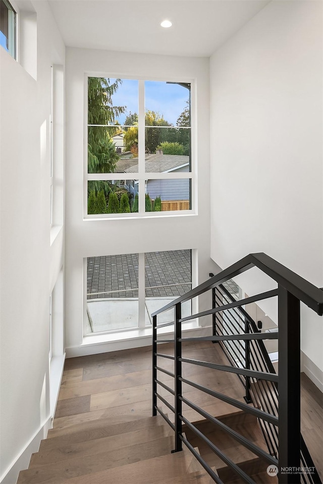 staircase featuring hardwood / wood-style flooring