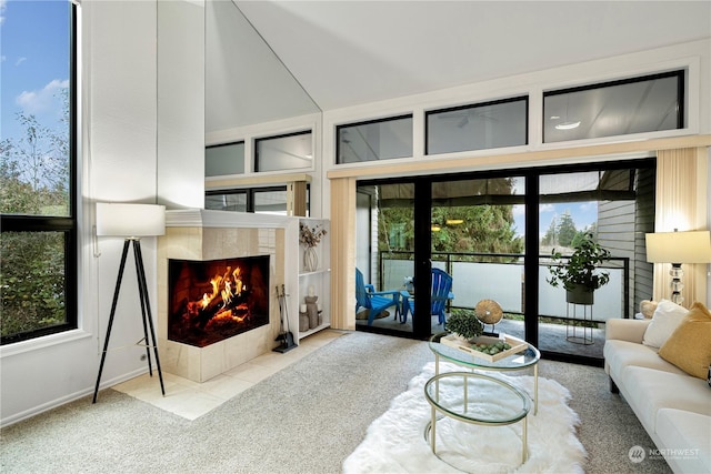 living room with light carpet, french doors, and a fireplace