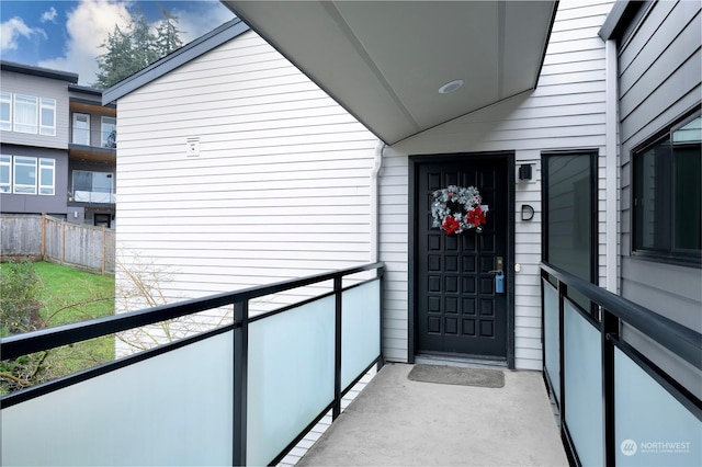 property entrance with a balcony