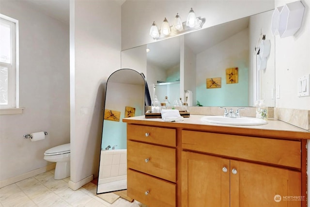 bathroom with vanity and toilet