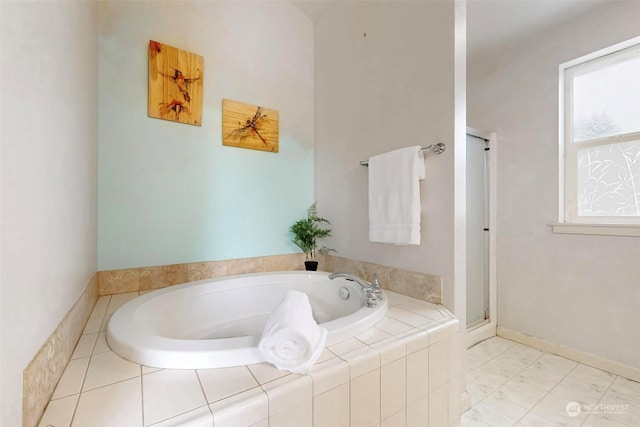 bathroom featuring tiled tub