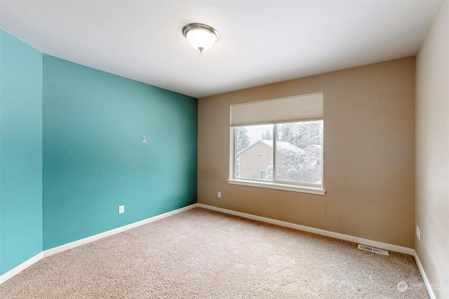 view of carpeted spare room