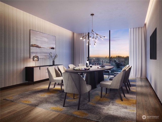 dining space with an inviting chandelier and dark hardwood / wood-style flooring