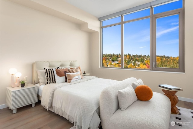 bedroom with light wood-type flooring