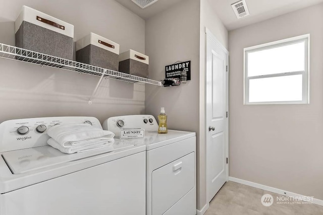 laundry room with separate washer and dryer