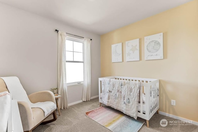 bedroom with carpet flooring and a crib