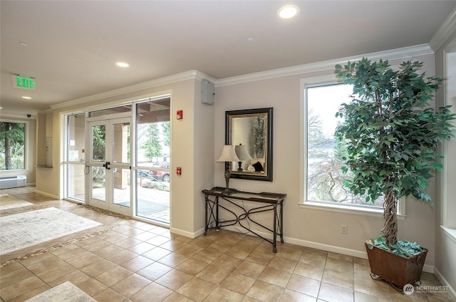 entryway featuring crown molding and plenty of natural light