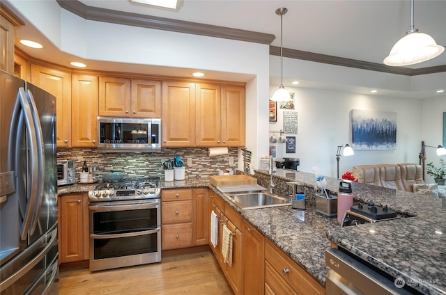 kitchen with dark stone counters, tasteful backsplash, hanging light fixtures, and appliances with stainless steel finishes