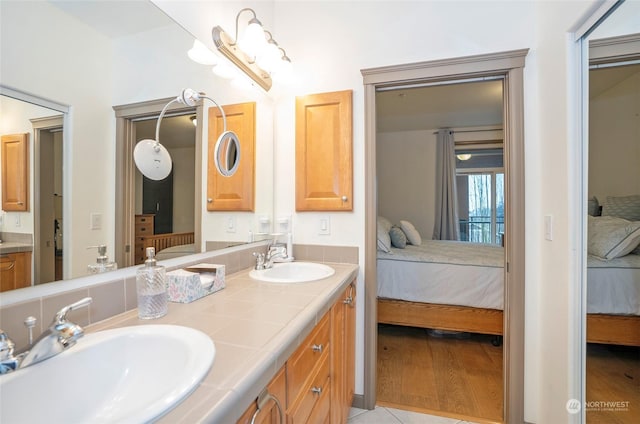 bathroom with vanity and tile patterned flooring