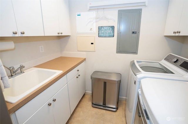 laundry room with cabinets, independent washer and dryer, light tile patterned floors, electric panel, and sink