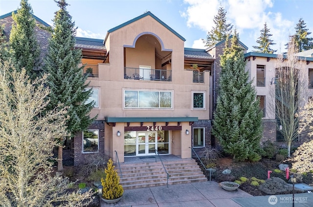 2440 S Steele St Unit 303, Tacoma, WA 98405 - exterior space with stucco siding and brick siding