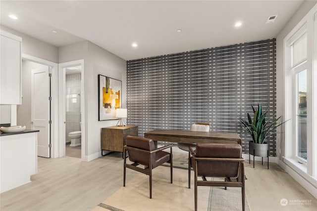 office area with light hardwood / wood-style floors