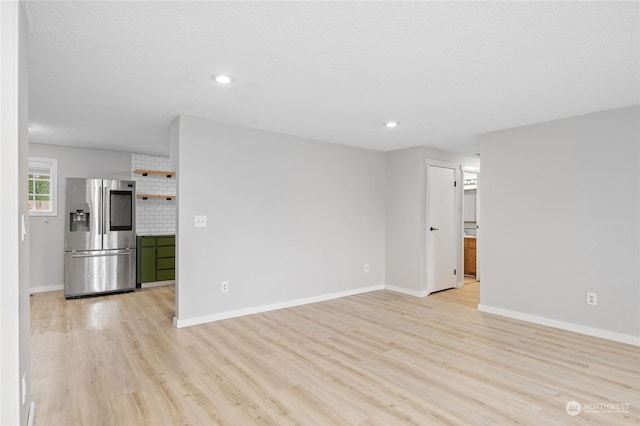 unfurnished living room featuring light hardwood / wood-style floors