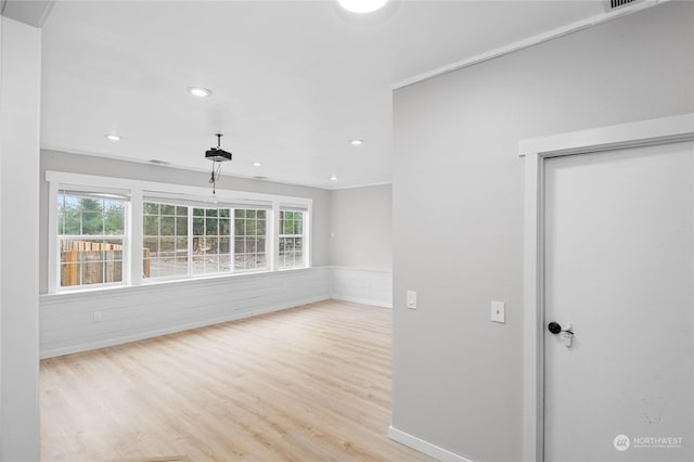 spare room featuring light hardwood / wood-style floors