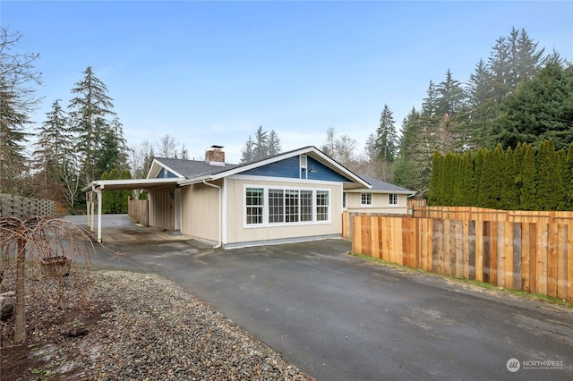 exterior space with a carport