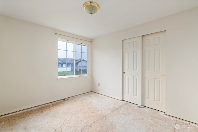 unfurnished bedroom featuring a closet