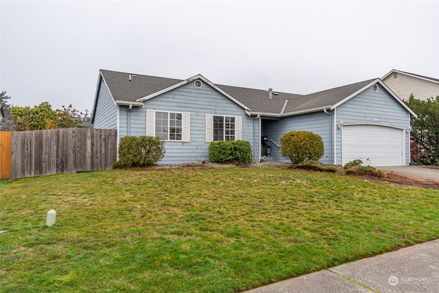 ranch-style home with a front lawn and a garage