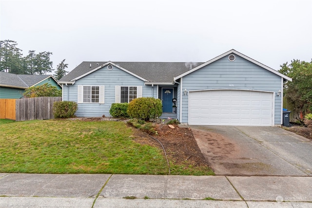 ranch-style house featuring a front yard and a garage